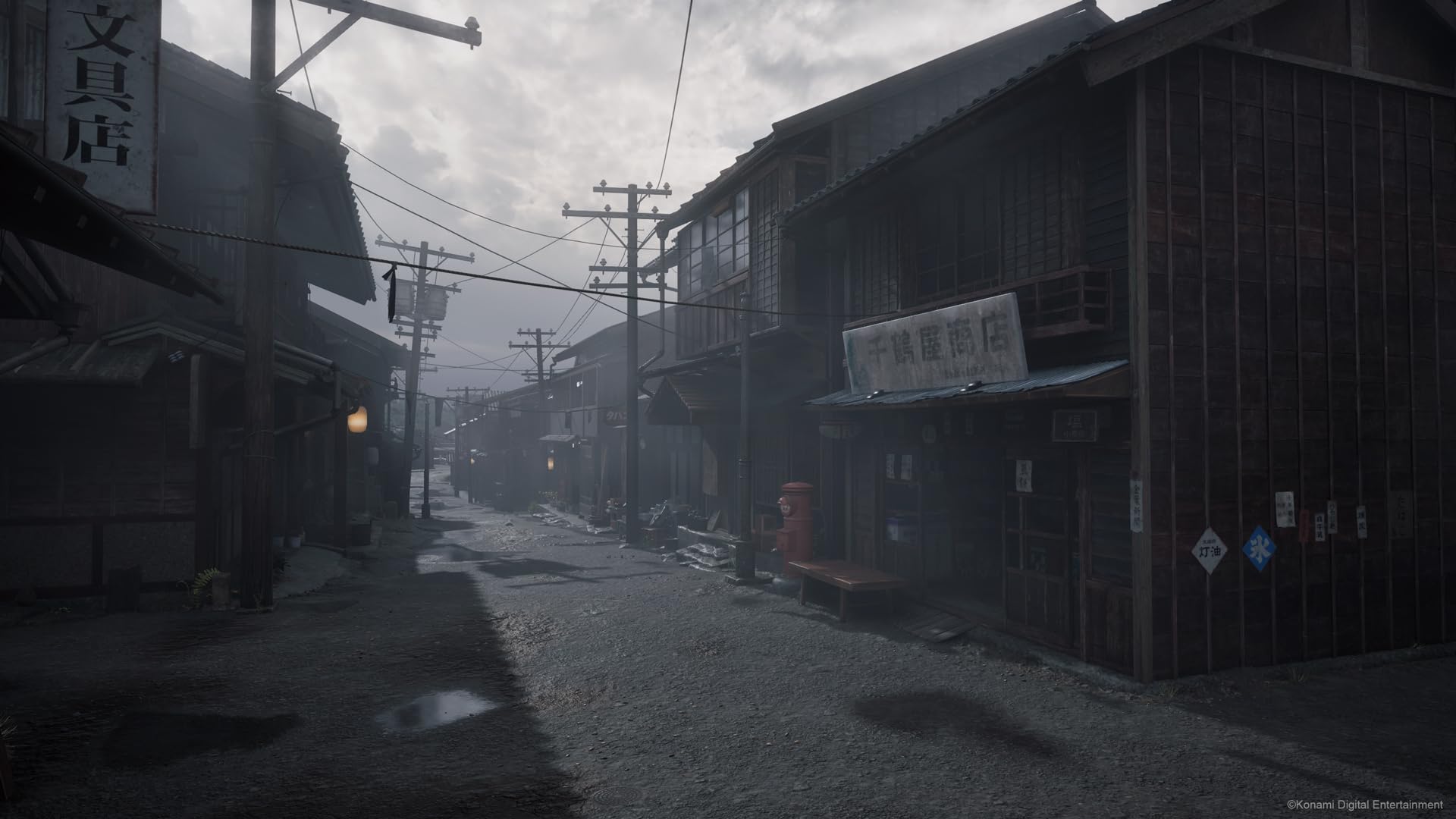 Dark and eerie street scene from Silent Hill f PS5 game showing foggy, abandoned buildings and power lines