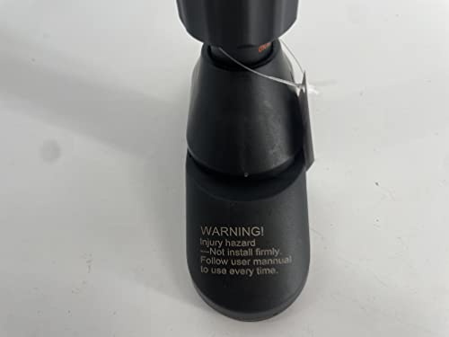 Close-up of pull up bar no screws base with safety warning label on black plastic surface