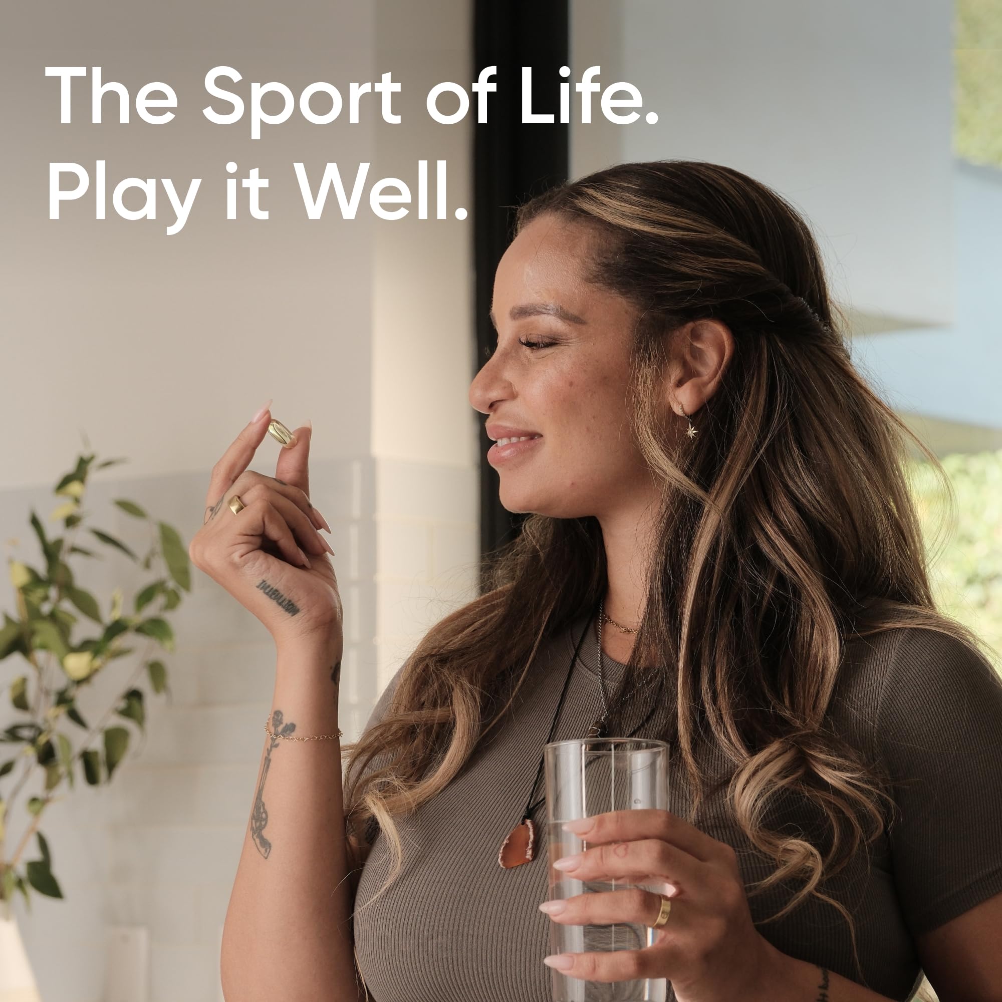 Woman holding a glass of water and capsule promoting triple strength omega 3 fish oil supplement