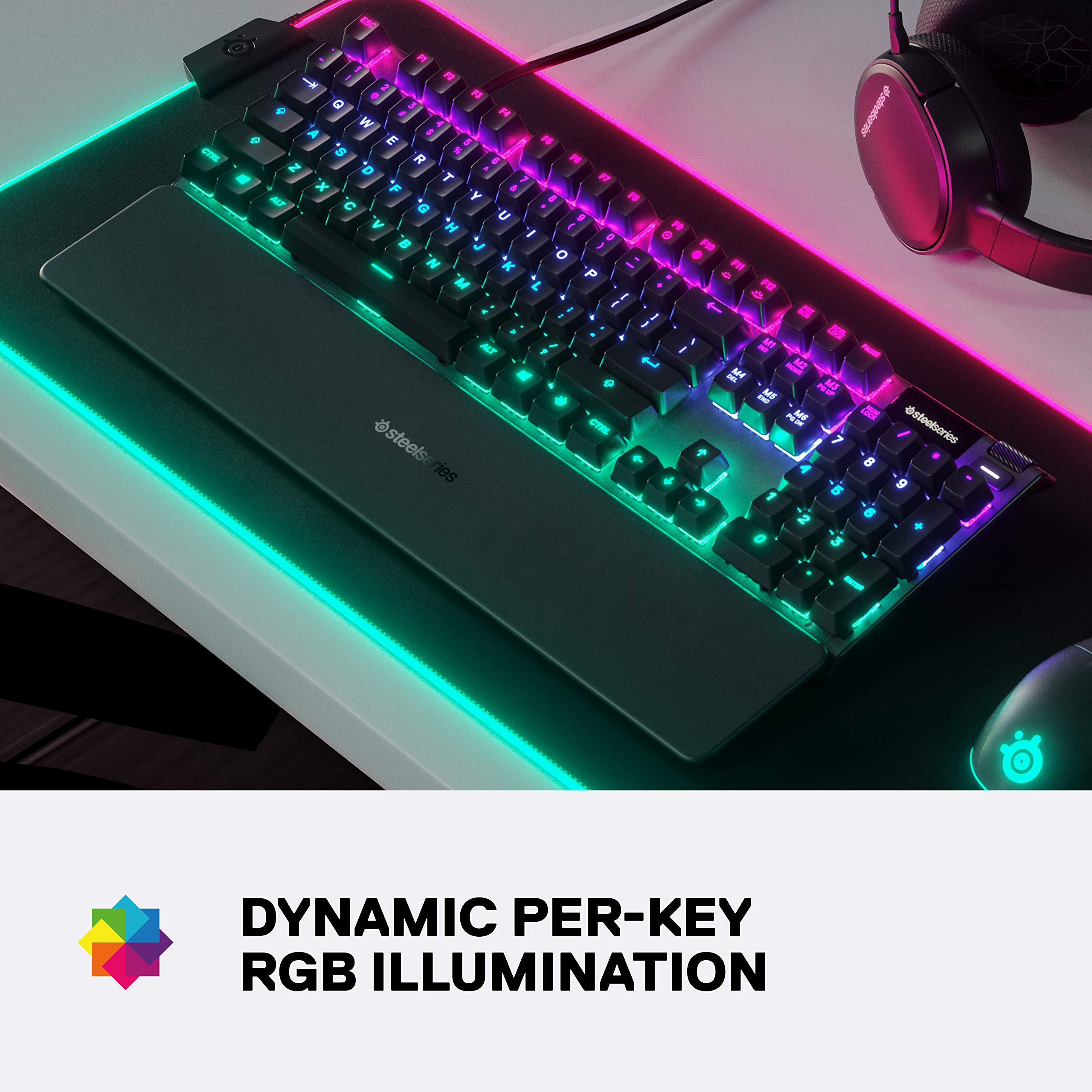 SteelSeries Apex 3 gaming keyboard with dynamic per-key RGB illumination on a desk with headset