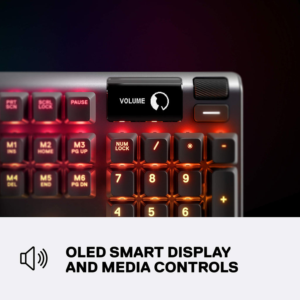 Close-up of SteelSeries Apex 3 gaming keyboard showing OLED smart display and media control buttons