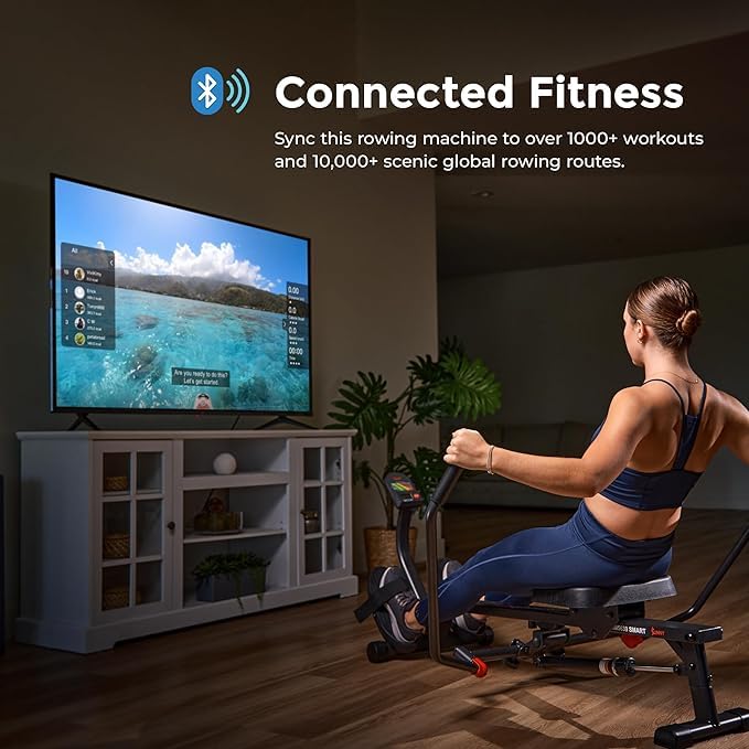 Woman using craques compact rowing machine for home gym with TV showing scenic rowing routes