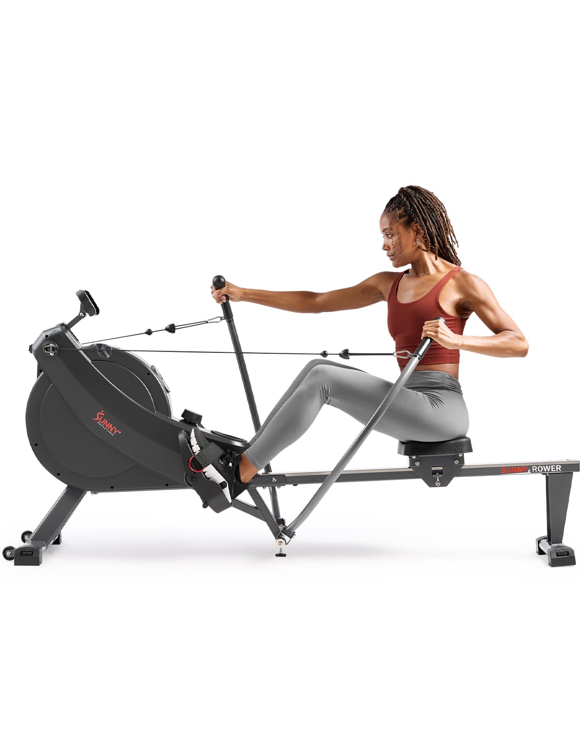 Craques compact rowing machine for home gym with a woman rowing in workout apparel
