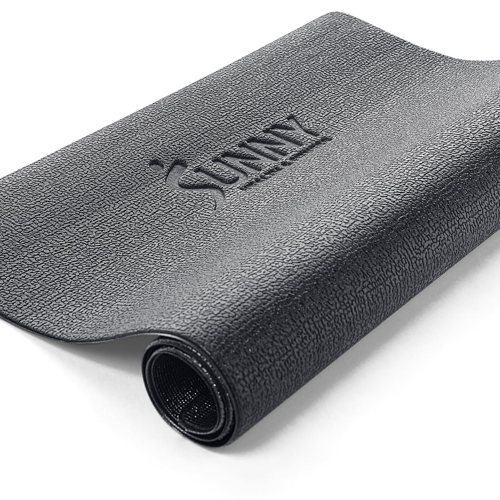 Black textured exercise mat rolled up with Sunny logo for mini stepper for home use