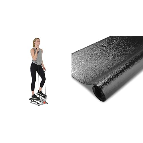 Woman exercising on a craques mini stepper for home use with resistance bands and a black exercise mat