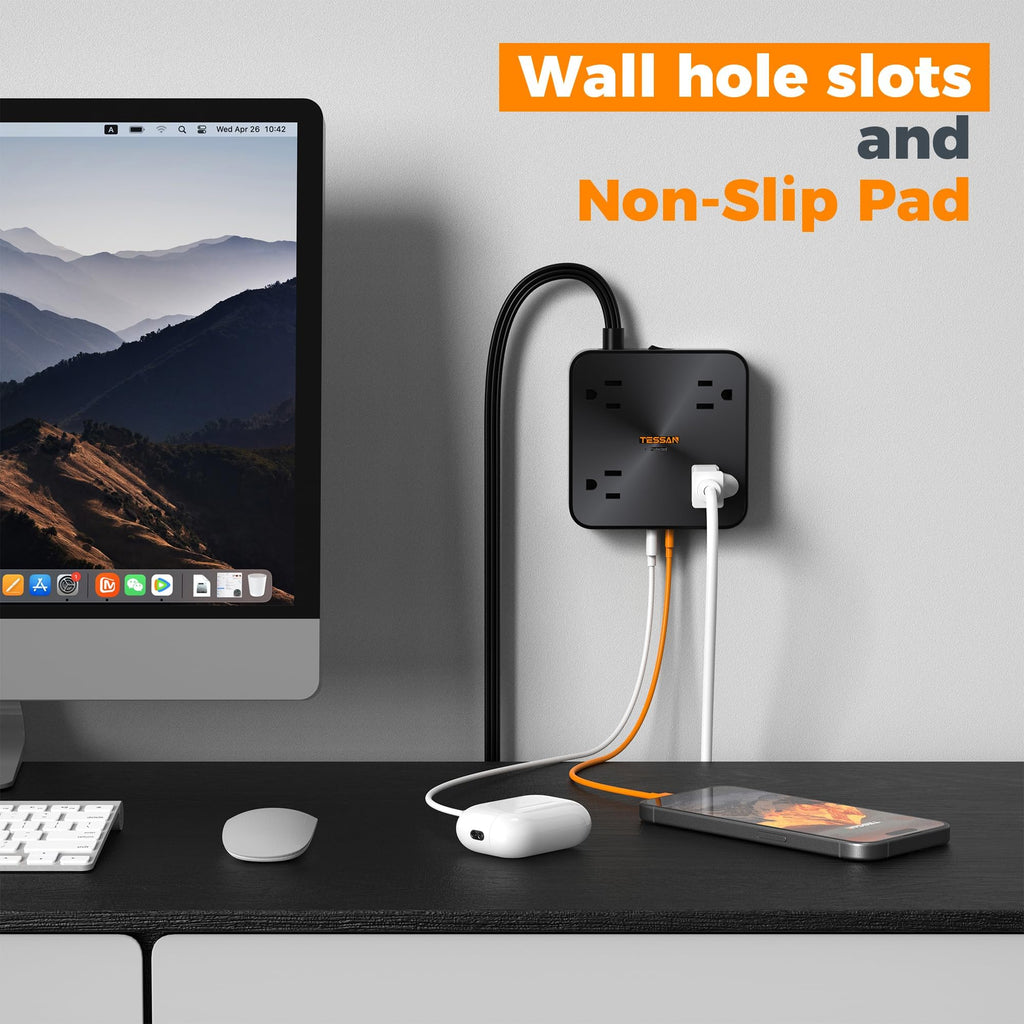 Craques flat plug extension cord 5 feet plugged into wall with devices on desk including computer and smartphone