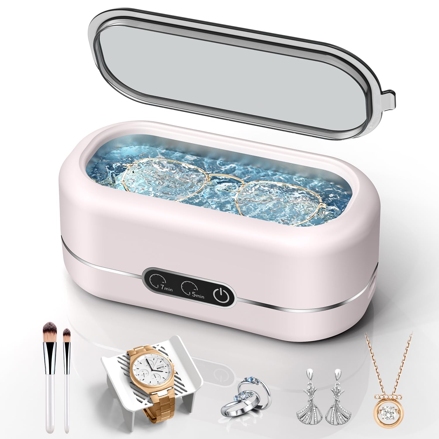 Craques ultrasonic jewelry cleaner in pink with glasses, watch, rings, earrings, and necklace in water