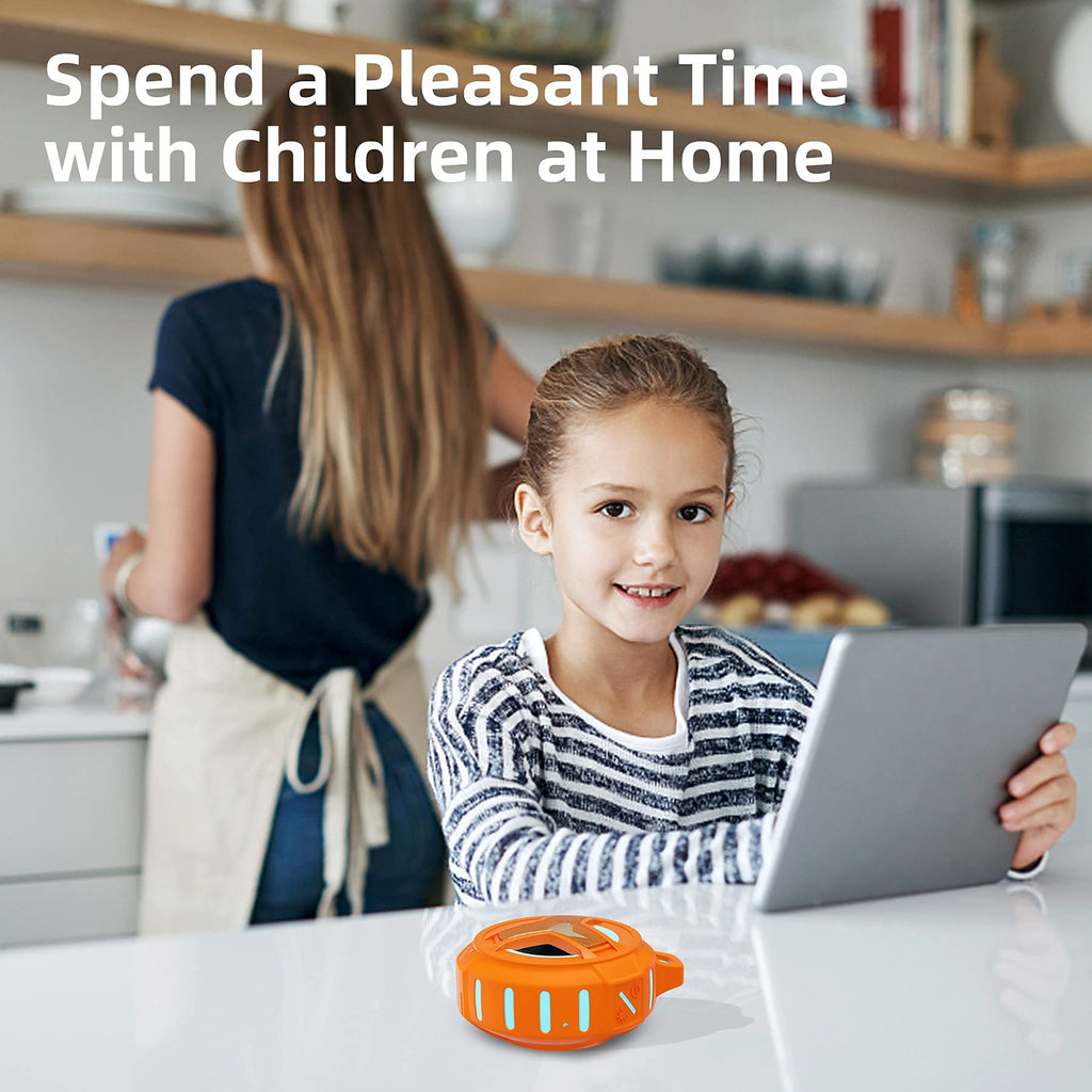 Orange waterproof Bluetooth shower speaker on table near smiling girl using tablet at home